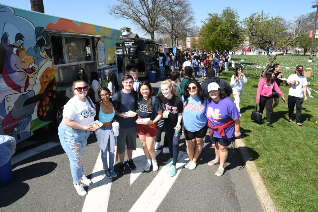 group of people in front of food trucks