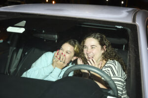 Girls screaming in cars at scream screen